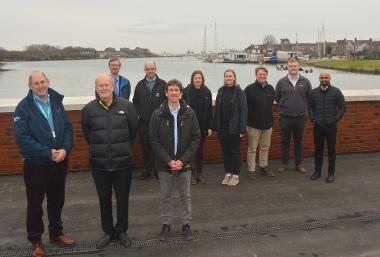 Group image next to finished wall